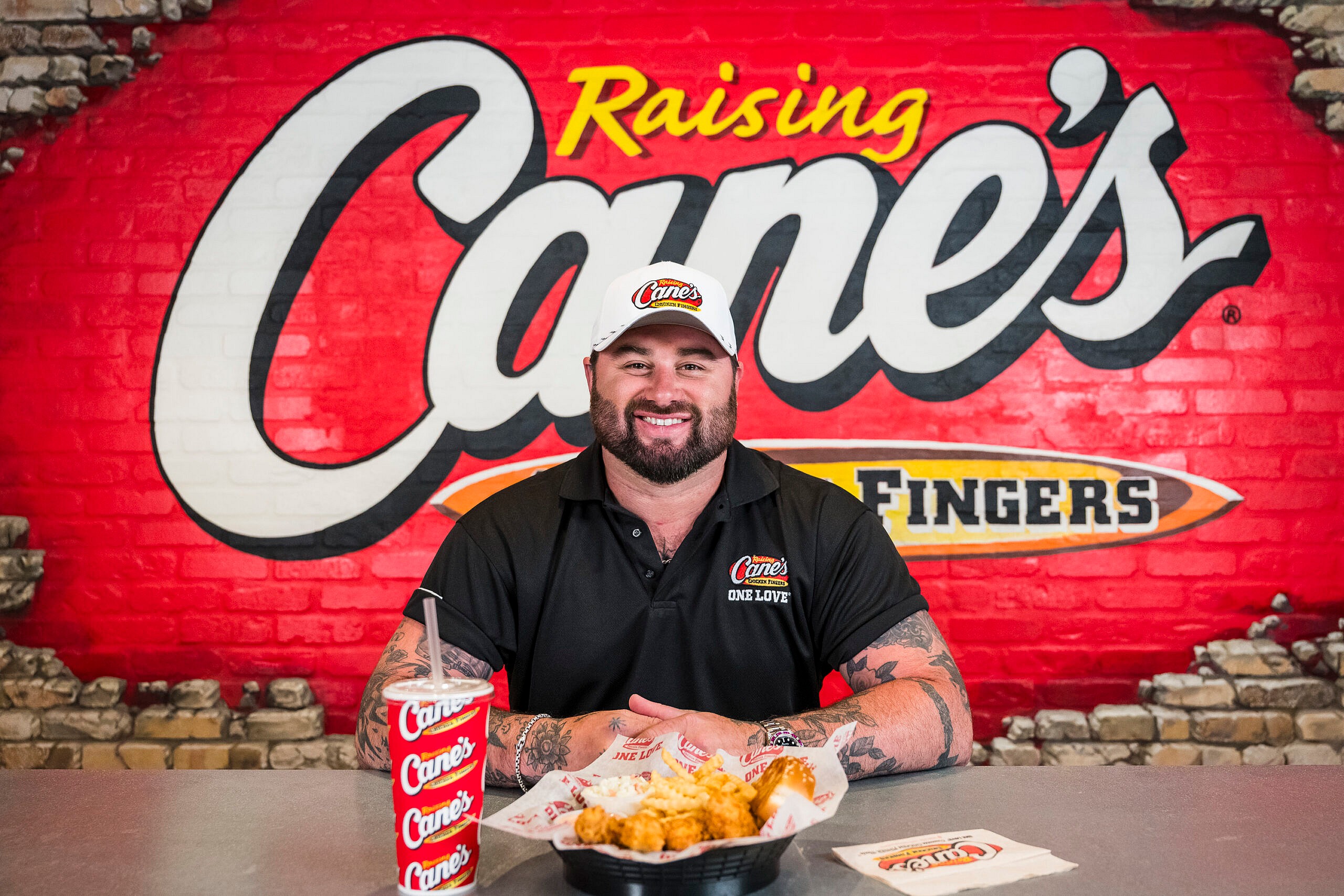 Singer/Songwriter Koe Wetzel and Raising Cane’s CEO Todd Graves at Raising Cane’s corporate office