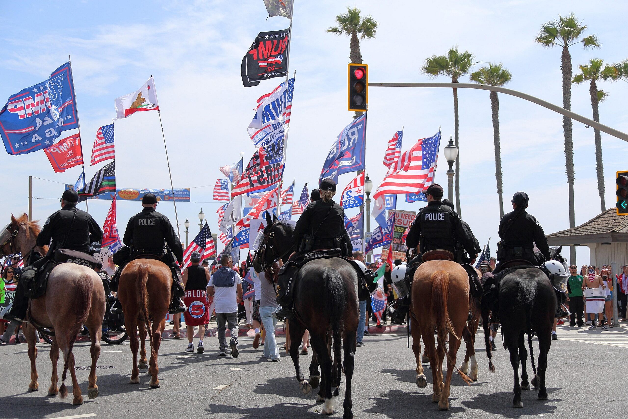 Protesters gather in Huntington Beach for the No Kings Rally