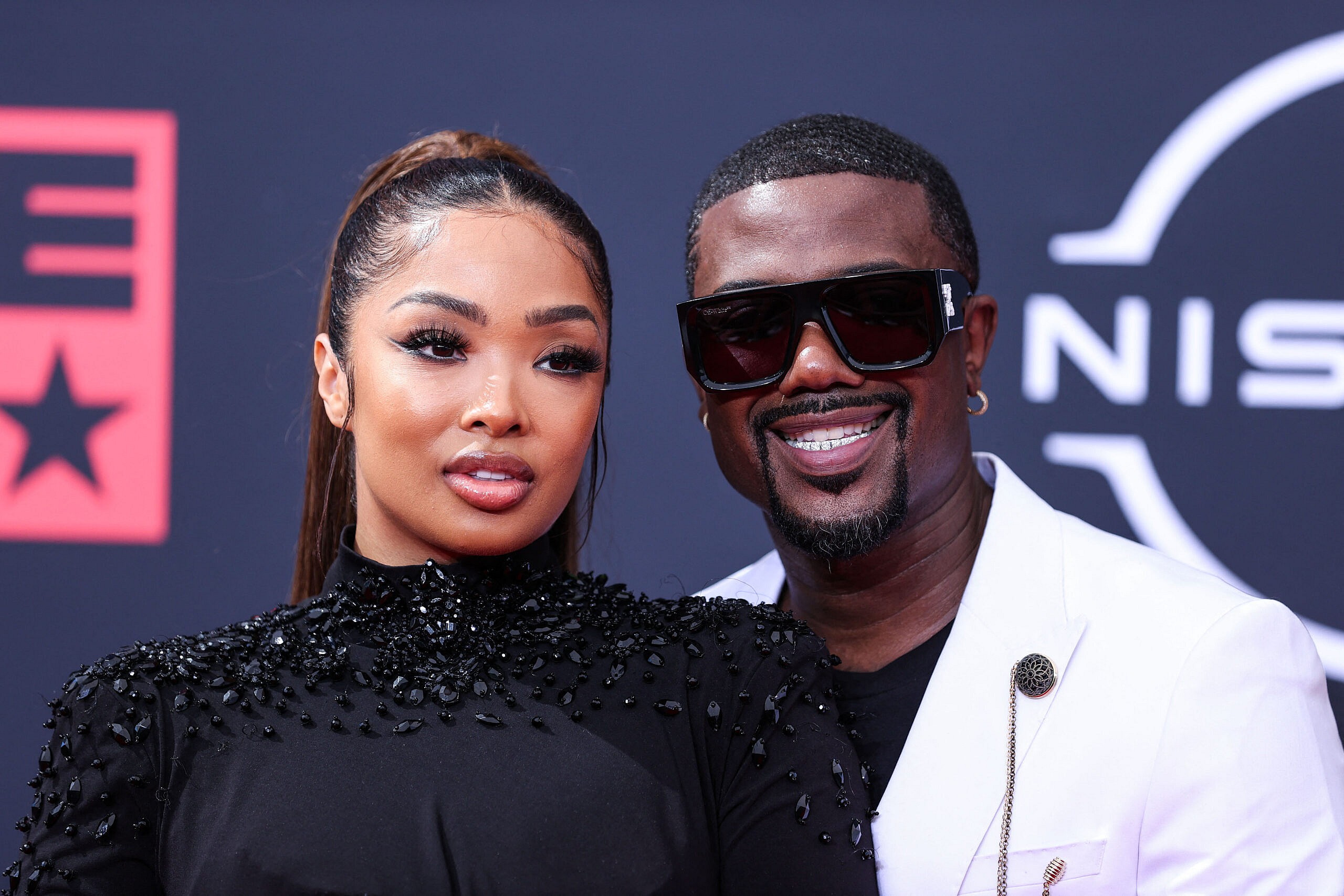 Ray J and Princess Love posing