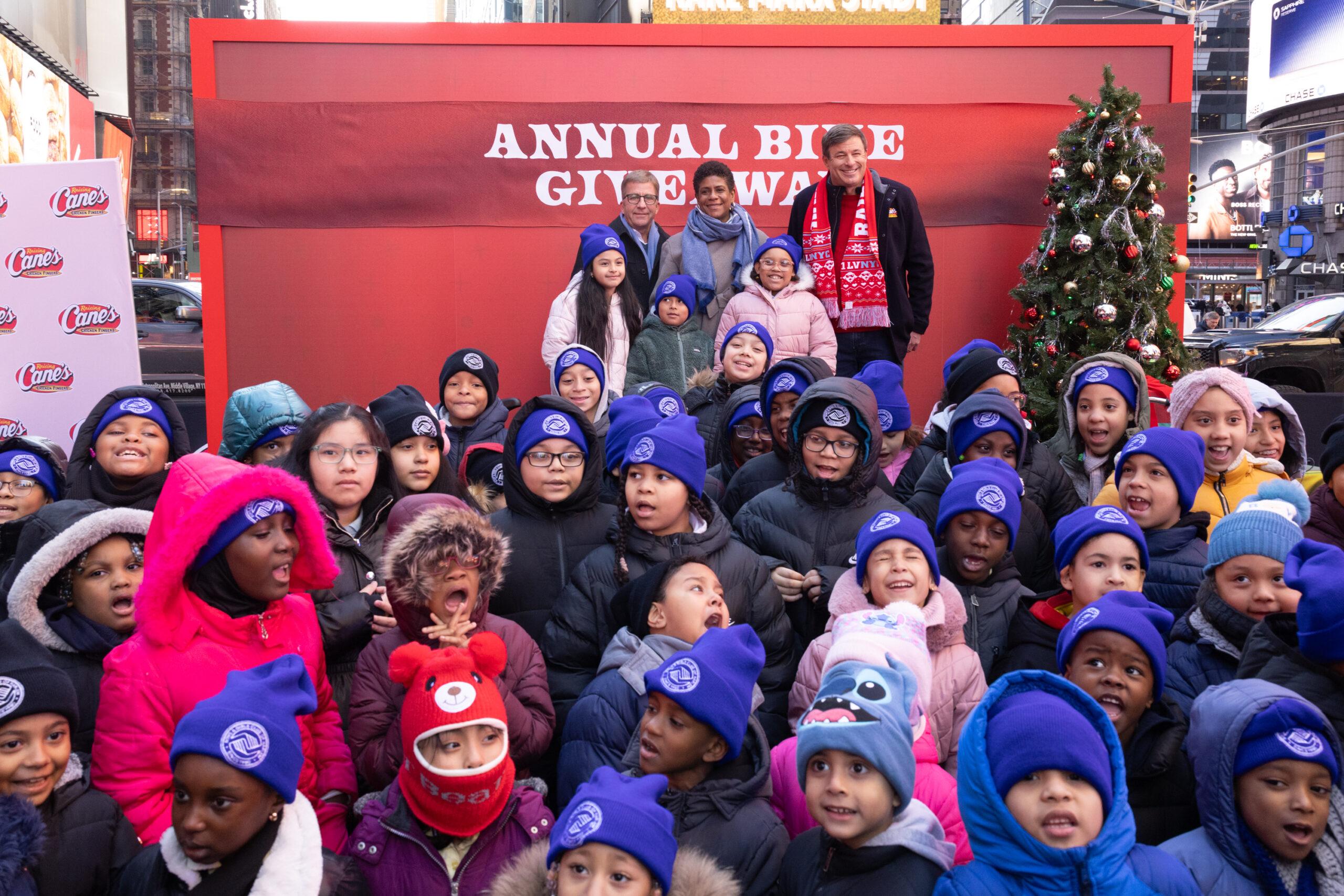Todd Graves and Peter Billingsley at Times Square with dozens of kids