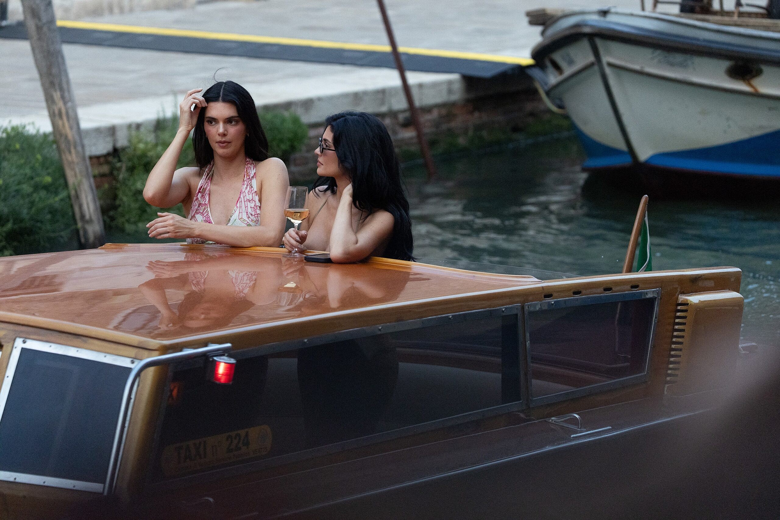 Kylie and Kendall Jenner are seen arriving for a lavish pre-wedding party hosted by Jeff Bezos and Lauren Sanchez, who also made a brief appearance under tight security.