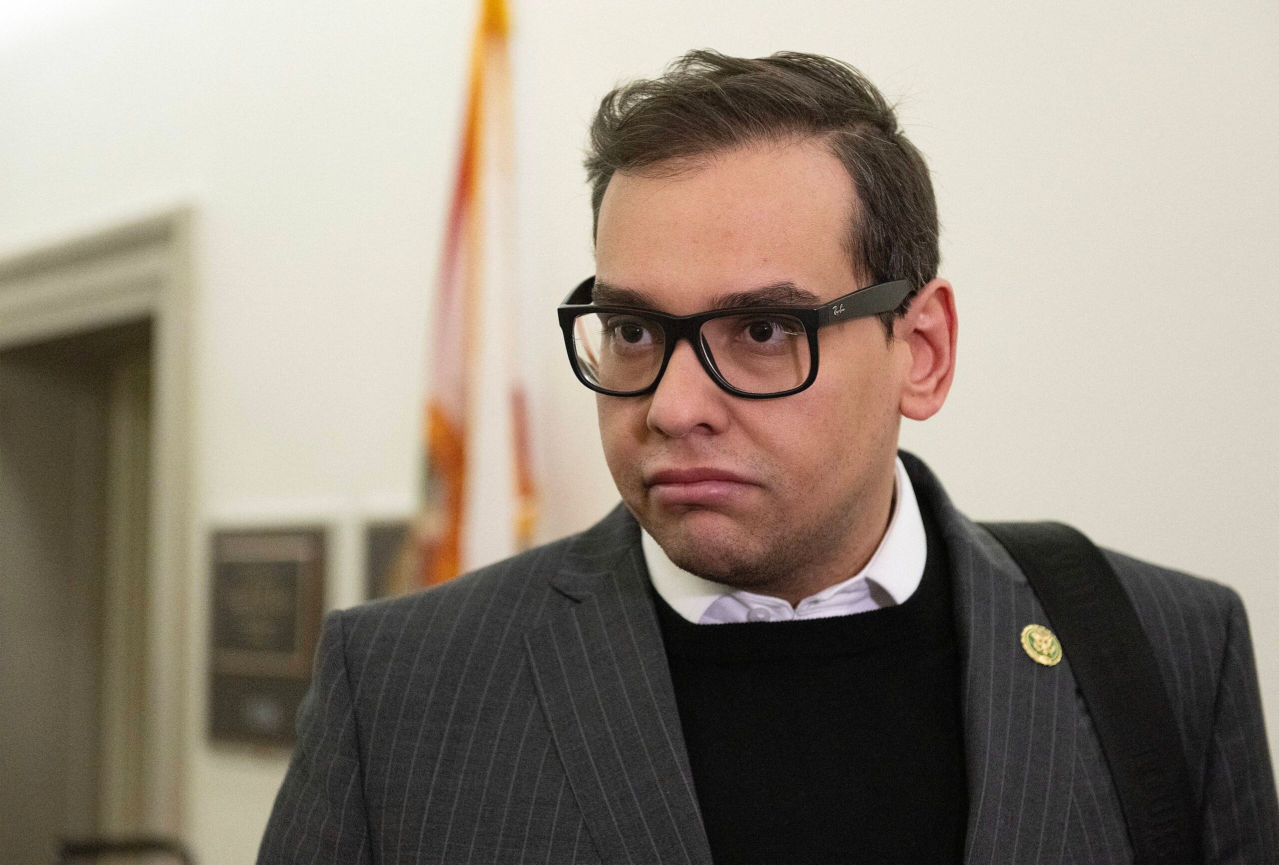 United States Representative George Santos (Republican of New York) speaks to a reporter as he arrives at his Capitol Hill office in Washington, DC