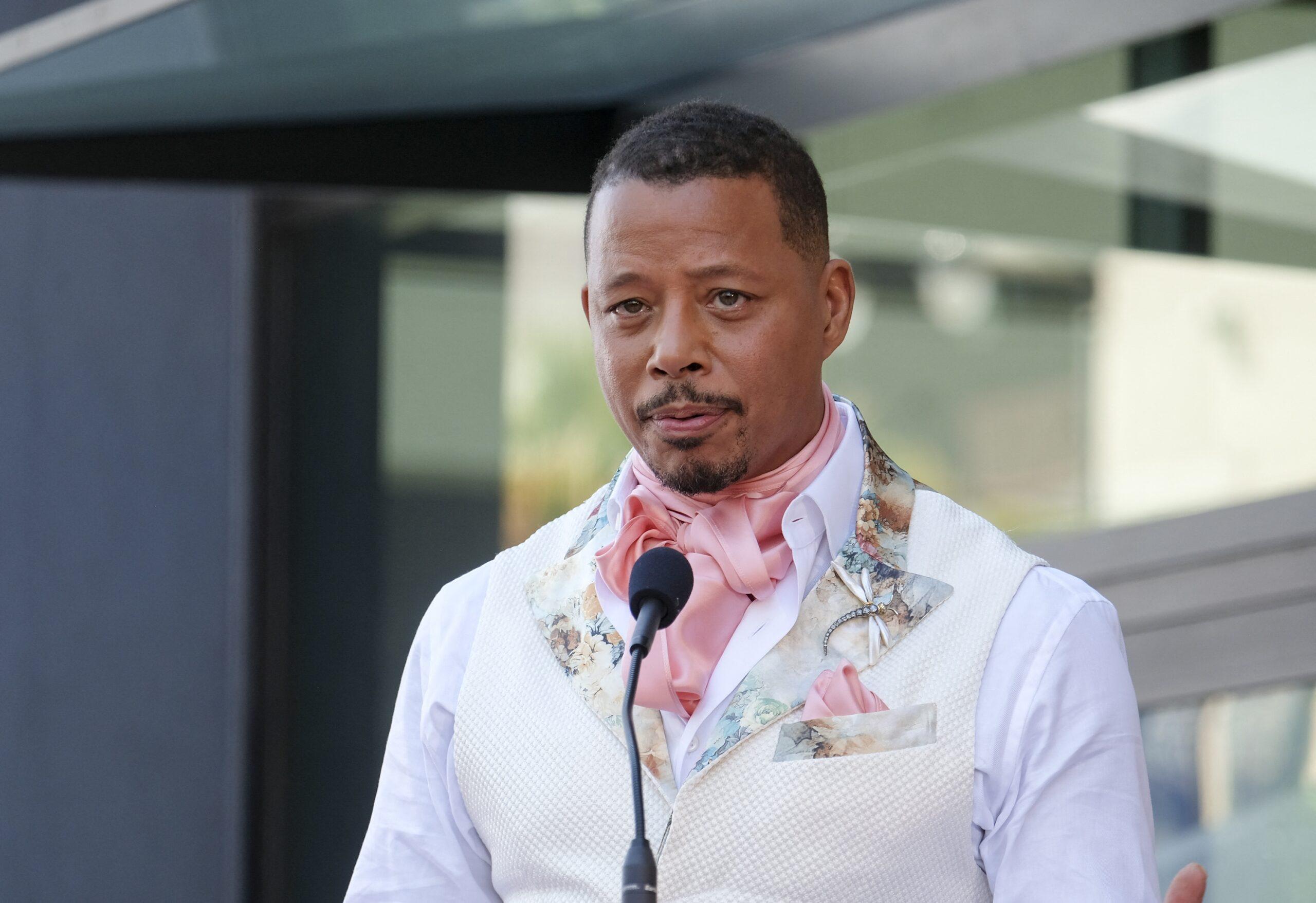 Terrence Howard posing outside.