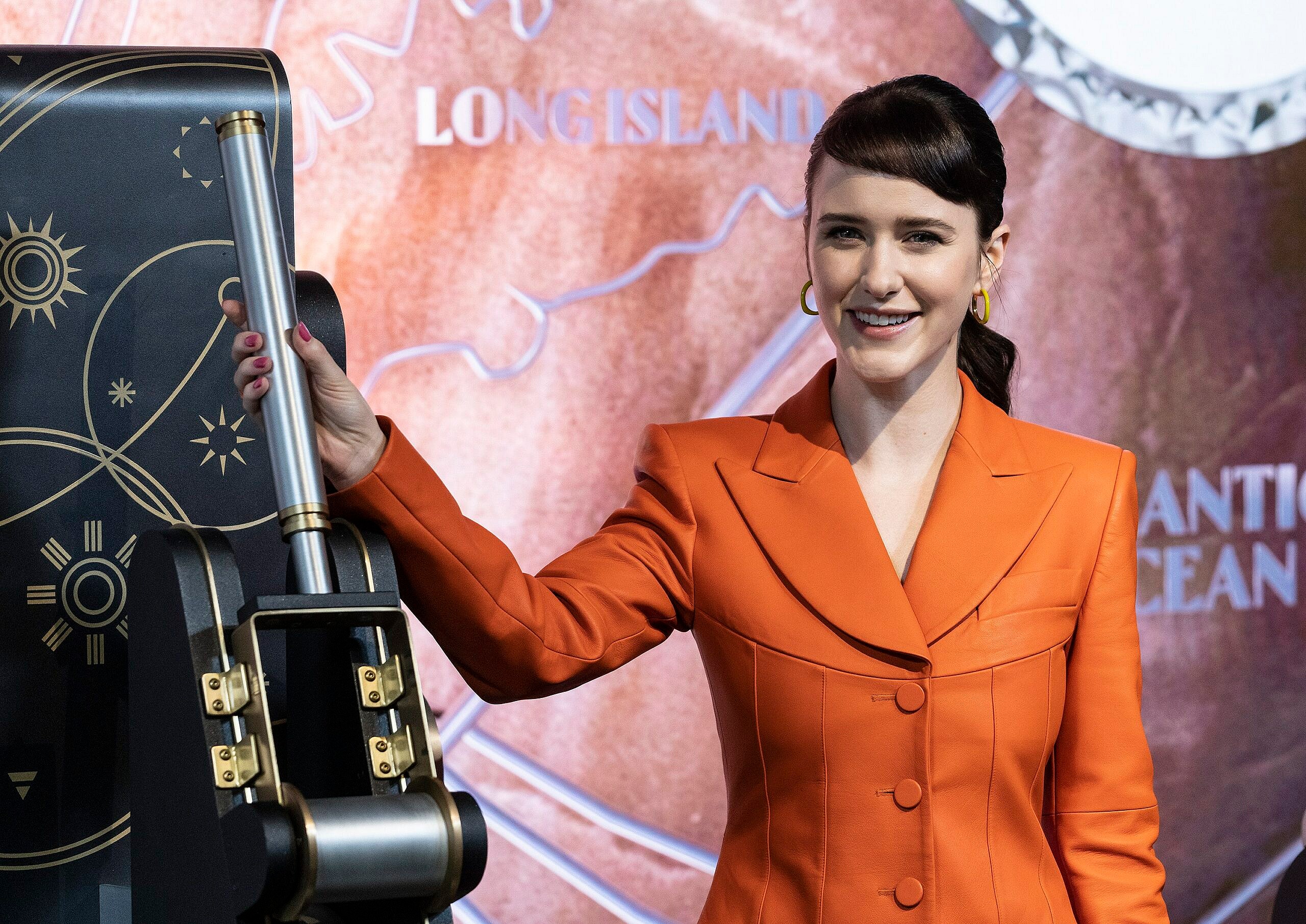 Rachel Brosnahan visits Empire State Building in celebration of Covenant House's 50th anniversary. 