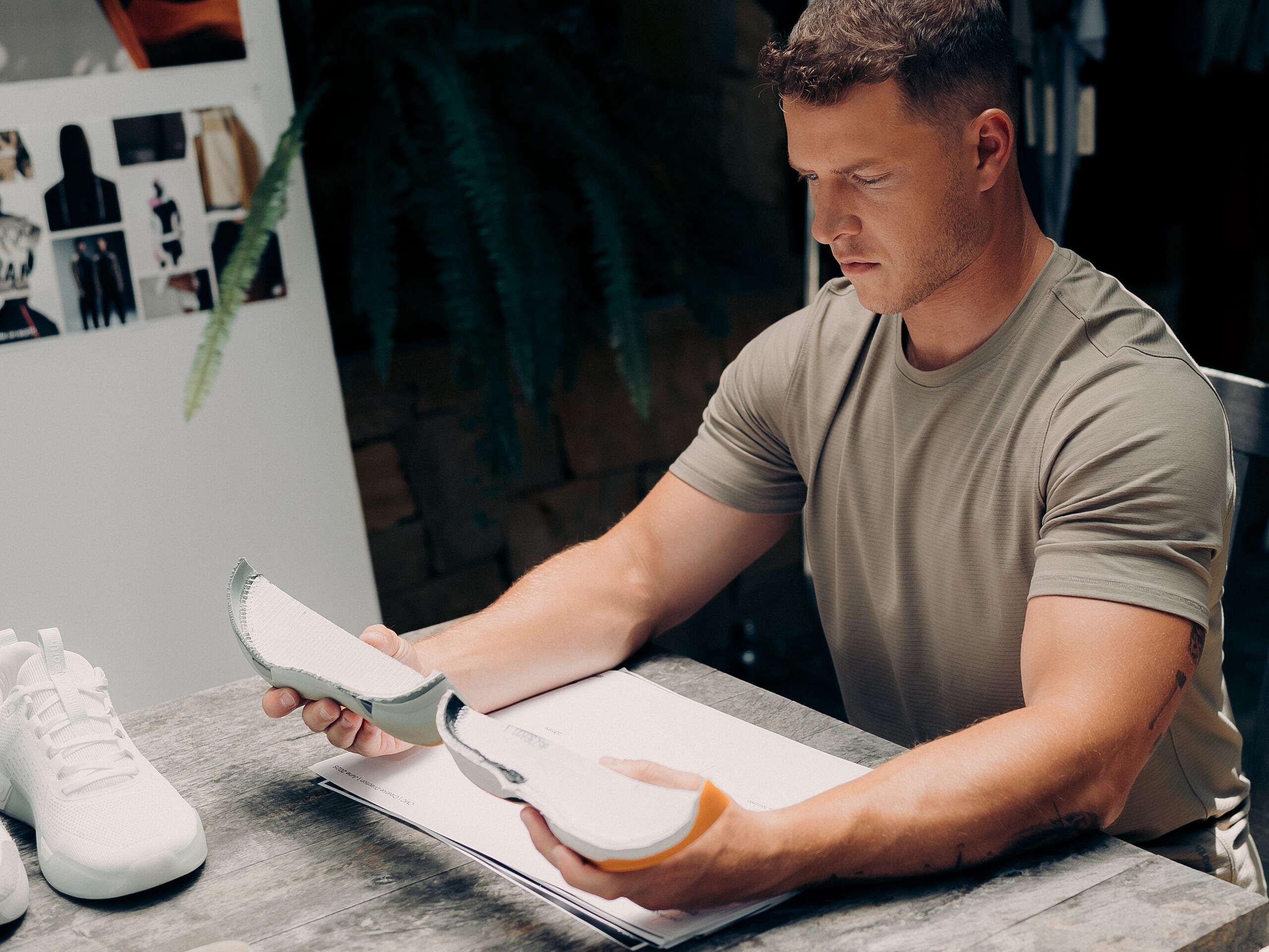 Christian McCaffrey looking at while on earth shoes
