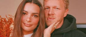 Sebastian Bear-McClard and Emily Ratajkowski posing together indoors