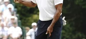 Tiger Woods reacts after making a birdie putt on the 15th hole during the first round of theMasters Tournament at Augusta National Golf Club