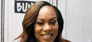 Sanya Richards-Ross smiling at a media event