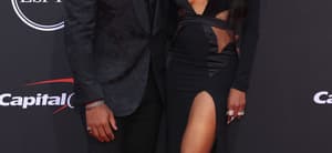 Russell Wilson and Ciara smiling.