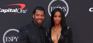 Russell Wilson and Ciara smiling.