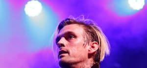 Aaron Carter performing on stage.