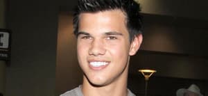 TAYLOR LAUTNER AT LAX