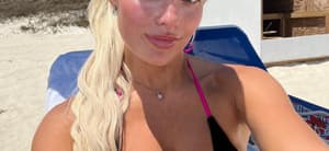 Hannah White taking a selfie at the beach in her bikini.