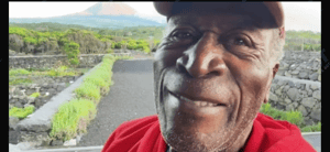 John Amos in a red jersey
