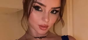 Demi Rose taking a selfie.