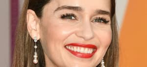 Emilia Clarke poses smiling