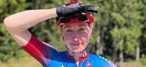 Katie Archibald shielding the sun while in her bike gear