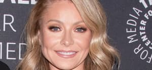 Kelly Ripa smiles at an event