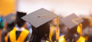 Students wearing graduation caps and gowns