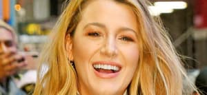 Blake Lively smiles in the street