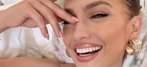 Jennifer Lopez poses smiling