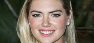 Kate Upton smiles at an event