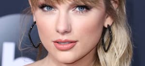 Taylor Swift poses an an event