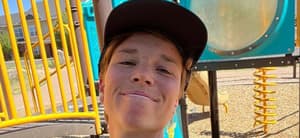 Nikki Hiltz posing on a playground