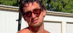 TooTurntTony smiling in sunglasses