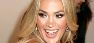 Carrie Underwood laughs at an event