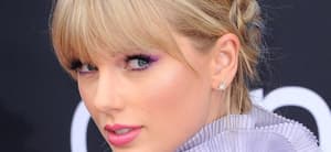 Taylor Swift poses an an event