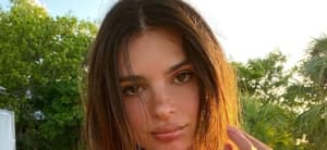 Emily Ratajkowski poses for the camera.