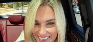 Kayla Simmons flashes a big smile in a selfie.