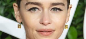 Emilia Clarke poses at an event