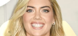 Kate Upton smiles at an event