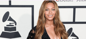 Beyoncé posing in a black dress during a previous Grammys red carpet event.
