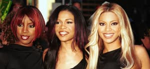 Destiny's Child posing in all black for a group photo in 2001.