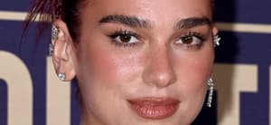 Dua Lipa smirking