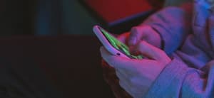 Person typing on their phone
