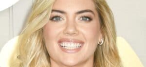 Kate Upton smiles at an event