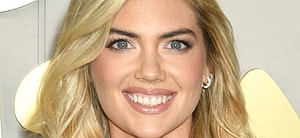 Kate Upton smiles at an event