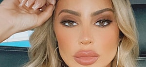 Larsa Pippen poses from a car