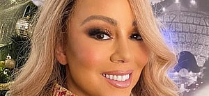 Mariah Carey poses smiling