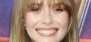 Elizabeth Olsen smiles at an event