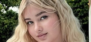 Anastasiya Kvitko smiles outdoors