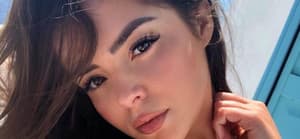 Demi Rose takes a selfie.