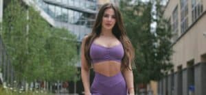A lovely photo showing Anfisa Arkhipchenko in a purple two-piece training outfit.