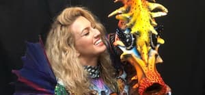 Tori Kelly takes a photo with her Seahorse mask from The Masked Singer