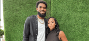 Karl & Jordyn in front of a green wall