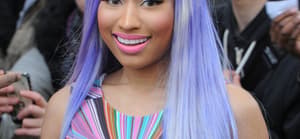 Nicki Minaj leaving the BBC Maida Vale studios The singer showed off her new blue hair and wore a multicoloured top neon yellow hot pants tights and neon yellow boots